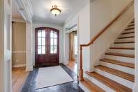 Sunny entryway leads into the dining, formal living/office, & den