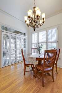 Informal dining area leads to screened porch
