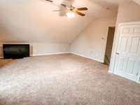 Large bonus room is just a few steps from the main level. Don't miss the HUGE 'attic' storage area through the door!