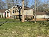 Click on the pic to enlarge. Lush landscaping in front& back of house. Owners pay yearly "Think Green" to service yard. '24 treatment plan (7 applications) has been paid. '23 replaced 10 shrubs/4 fir trees. Come see what a beautiful maintained place.