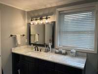 This bathroom is stunning --- large room.  ALL new!!!  New marble counters.