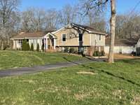 In '18 blacktop driveway was resealed. Will accommodate many cars for your parties, holidays, etc. In front of the 3 car garage you see in pic - probably can park 6 or 7 cars. Plus if you do not mind cars on the grass - no telling how many.