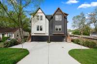 A well-laid out driveway with room to navigate in and out of the property. Each unit accommodates four parked cars: two in its over-sized attached garage and two outside in its dedicated parking pad.