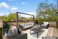 Virtually staged wood deck patio from Unit B photo.