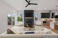 Virtually staged photo of next door's Living Room, in Unit B.  Differences: black ceiling fan, black fireplace, black kitchen cabinets & different window views on opposite of property. So, Unit B with its black theme is an option.