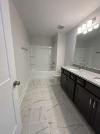 Double vanity in the upstairs bathroom for convenience