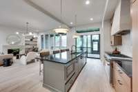 The kitchen flows so nicely into the living and dining area...and of course the outdoor screened in living area.