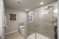 Tile floor and large tile shower make this space spa like!