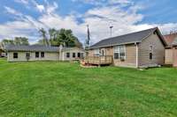 Back side of main house and back of cabin showing the deck area where you can relax and enjoy the lakelife.