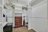 Large walk-in closet in cabin bedroom.