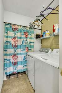 Laundry room in main house. Washer & Dryer stay with the Home.