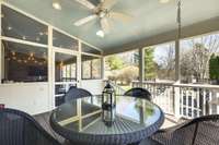 This part of the porch is unscreened but still covered and the perfect spot for Al fresco dinners.