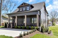 Built on a corner lot, owners can utilize the convenient parking pad or reserve the front for guests & build a garage on the alley access out back. Note how the front porch spans the width of the home, perfect for greeting guests & entertaining.