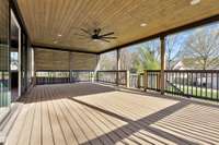 Considered by many as the favorite aspect of the home, the porch overlooking the backyard runs the entire width of the home, 30ft wide & 8.5ft deep. A privacy screen borders the east side, while a stair to the backyard is installed to the west.