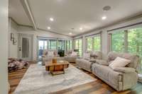 There are several flex spaces in this home.  This window-filled sitting room can also be used as an office.