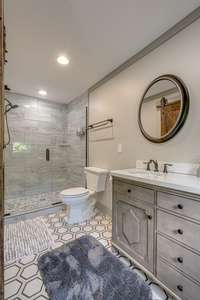 This one has a spacious and stylish shower.