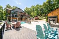 Between the main house and the pool house is another wonderful space for entertaining and enjoying lake views.