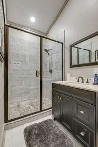 In each bathroom, luxurious tile lines the custom showers.  You'll also find stylish vanities in each one, as well.