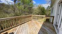 From the rear deck you can see and hear the two creeks that border the north and west sides of the property.