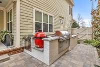 Kamado Joe smoker and huge grill are built in. There's a sink and a cooler included.