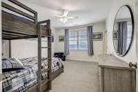 The 3rd guest suite upstairs is spacious as the rest! A walk-in closet provides great storage and organization.
