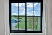 View from 2nd Bedroom on 2nd floor of the barn and pasture on property