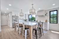 Designer Kitchen with luxury lighting and a large middle island