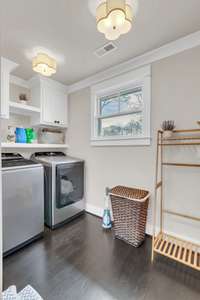 Second floor laundry room - there are laundry hook ups on each floor of the home! On the main level they are located in the primary closet