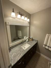 GRANITE COUNTERTOPS IN FULL BATH UPSTAIRS.