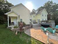 BACK PORCH OF STR WHICH WOULD ALSO MAKE AN IDEAL PRIVATE EXTENDED FAMILY QUARTERS.