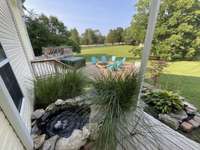 WATER FEATURE BESIDE STR PORCH HAS UV STERILIZER PUMP/ FILTER  & LED LIGHTING.