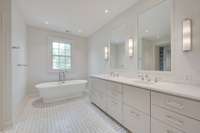 Once again, the balance of tradition and modern style hits a perfect note in the master bath. Beautiful marble, large freestanding tub, vanity and shower with its own shaving mirror make starting the day just a little bit easier.