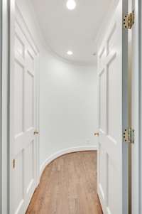 The curving hallway alludes you are going into a "special space" as it leads you to the primary bedroom.