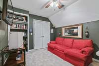 Through the closet doors is access to attic storage.