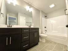 Upstairs hall bath (photo is of model home with same floor plan)