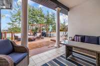 Covered tile patio is awesome for relaxing and watching a game on TV or just taking a break from the sun after a long day of swimming