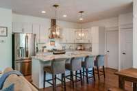 Kitchen with room for 4 barstools.