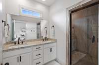 Primary bathroom with large shower and double vanities