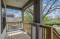 Welcoming and quiet front porch. Great for morning coffee on the swing!