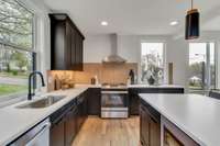 Loads of natural light, stainless appliances and designer lighting