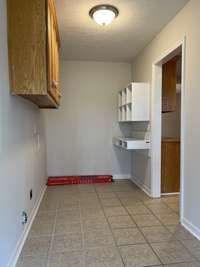 large utility room with exterior access from the covered deck