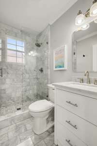 Full marble bathroom on the first floor is perfect for guests.