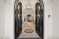 Step inside through the custom arched doors