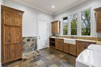 The laundry/utility room has a dog wash for your furry friends!