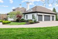 The four-car garage has rapid EV charging.