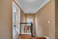 Stair landing second floor note Hardwood Floors continue upstairs