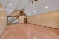 Natural light floods in through three expansive windows, illuminating the newly painted concrete floors. 2314 Racquet Club Dr.     Murfreesboro, TN 37128