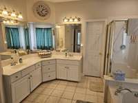 Master bathroom with new lighting and plumbing.