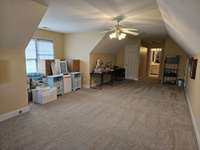 Upstairs can be used as a bonus room or bedroom. Has several walk in closets as well as a full bath.