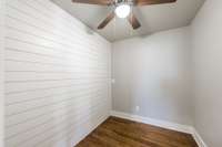 And here it is empty so you can see the hardwood flooring and accent wall. This room gives you options to make it whatever you desire.